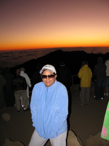 Day 6
Our very, very early morning climaxed atop Haleakala crater at 10,000 feet with a brisk 50-degrees temp.  We watched the sun rise and kind of got a double sun rise as the sun rose from the horizon under a break in the clouds as well as over the clouds.
