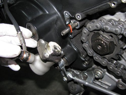 The stock clutch slave removed.  Look at all that black crud!  Give the area a good wipe down with a clean rag.  Smear grease on the clutch push-rod if you wiped any off.  I smeared white lithium grease on the mating surface of my Oberon, mimicking the stock application.
