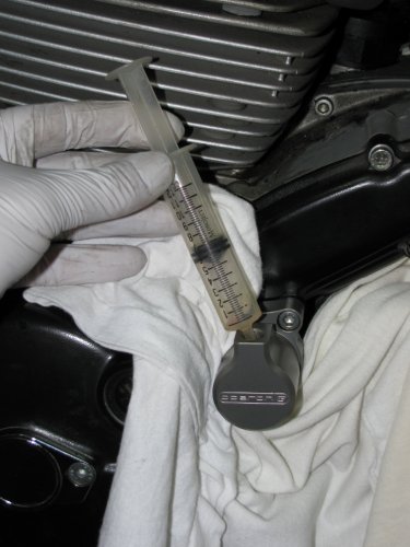 Once the clutch slave is bolted down (10 ft-lbs) pre-fill with DOT-4 brake fluid.  I used a syringe and found 6cc to be enough to reach the bottom of the threads.  Next, remove the banjo fitting from the stock unit and put it on the new one, torquing it down to 23 ft-lbs.
