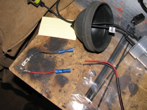 For the particular bulbs that came in this kit (an early version), I had to cut the wires and then feed them through the gasket.  I used butt connectors and high-quality crimpers (expensive) to secure the wires.
