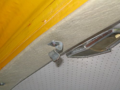 Trim at front of roof opening (that broken dome light is the front unit).
