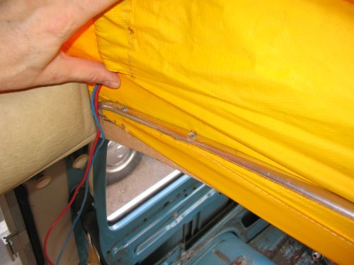 Front left corner.  Wires feed Riviera pop top light.
