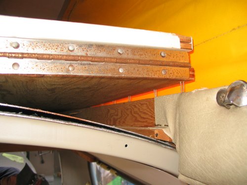 The bed is held in by loooong staples.  Simply puuuuuull up on it to rip it free.  It's in there quite well!
