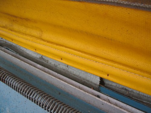 Detail.  Showing that the sealing tape is (somehow) between the lower canvas and framing.
