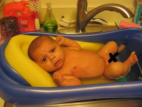 If you don't stop taking pictures of me during bath time, you're gonna be eating that camera, Bub!
