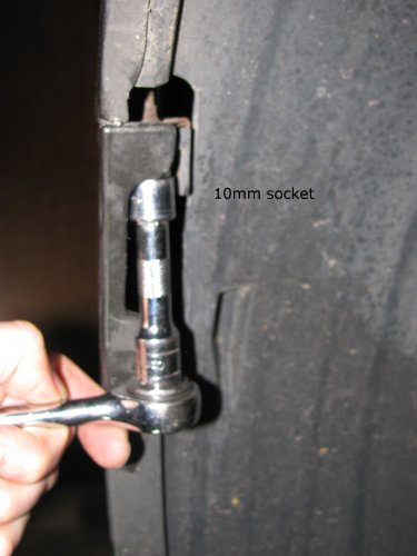 Mounting the LED array.
Remove the bolt that holds the bumper skin to the upper quarter panel (left side shown).  It is above the two wheel well screws.
