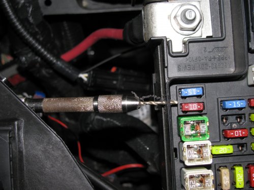 Connecting the DRL LED array.
I used a hand drill with a 2mm drill bit (smallest I had) to carefully drill a pilot hole into the side of the relay box.  The pilot hole is 7mm down from the top of the lip of the fuse/relay box.  It's between fuses M20 and M27.
