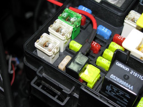 The fuse tab plugged in and with the stock 20A fuse in the BOTTOM.  The top fuse will be a 1A to 3A item -- what ever is the smallest I can find -- since the LED array doesn't pull an appreciable amount of current.
