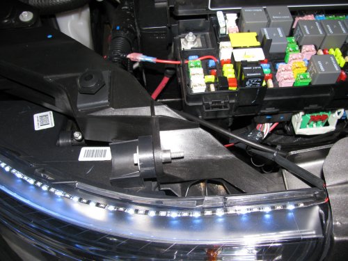 Just testing the left DRL LED array directly to the relay box.  Used the camera flash to 'dim' the LEDs so they wouldn't wash out the picture.  They are so bright that it can be seen that they are on.
