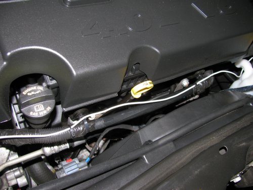 Routing the power feed wire along an existing loom.
