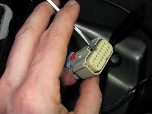 Next, use a small screwdriver to lift the inner plug out.  It only moves a few millimeters so you don't need to completely remove it!
