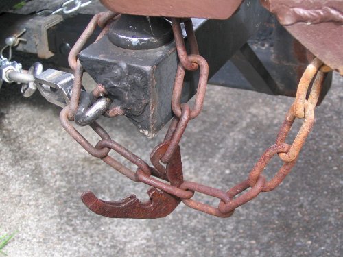 Odd looking (original?) safety chain clip.

