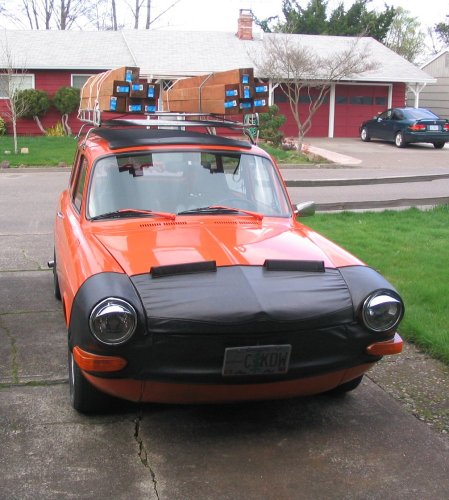 A quick way to drop the ride height of your ride over an inch!
My trusty baby hauling 14, 4"x4"x8' boards and ground cover (inside, in the extended cargo area).  A semi-show car and she still has to come out of the garage from time to time and help out :-)
