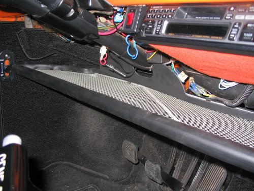 For these pictures I don't have the back-splash inserted in the retaining clips but this shows how it's used to keep items from falling out the front of the parcel tray (remember, front of car is front).
