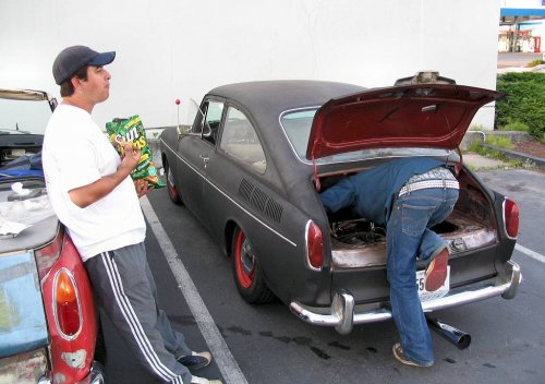Looks like a Fasty is giving birth to a mechanic!

After the boarder crossing Bob was having some issues with his ride.  A new engine air boot, re-clamping his left air cleaner base, and off-setting the top of the rear trunk lid (he's not running with an engine lid) greatly helped out his ride.  We got home after 2am (and it was chilly in The Bucket) but it was all worth it!
