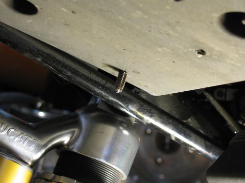 Make sure you tap all the way through the hole.  You will get a fair amount of brass flakes so be sure to vacuum your mess up!  In hindsight, I'd recommend covering your tire and chain guard with a large rag.
