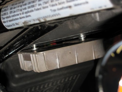 To mount the R/R, I used two 6mm x 1.00 x 25mm stainless steel cap head bolts.  Between the R/R and seat pan are two stainless steel washers (same size as the bolts).  These act as a spacer to put an air gap between the R/R and the seat pan.  Remember, we want air flow all around the R/R so don't mount it flush to the seat pan!

I do NOT recommend using the stock bolts!  I used stainless steel since the fasteners will be exposed to the elements and we don't want to deal with rust later on.  The bolts are also 5mm longer and this allows more of the bolt to thread into the brass nuts.  I also used blue thread locker.
