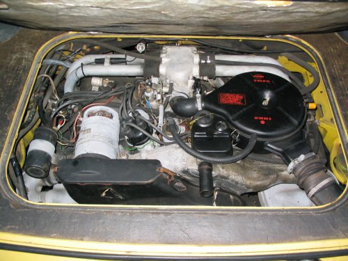 Nice rebuilt fuel injected engine.  Automatic kick-down switch missing and she's going to need a new cold-start injector/harness as the previous one was *melted* :-(
