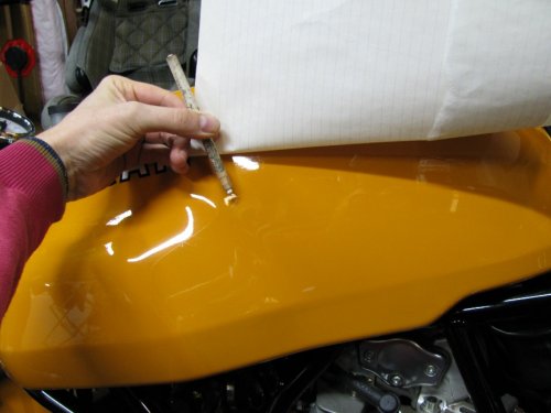 Using a grease pencil to mark the tank where your outline is.  This is to help place the pattern later.
