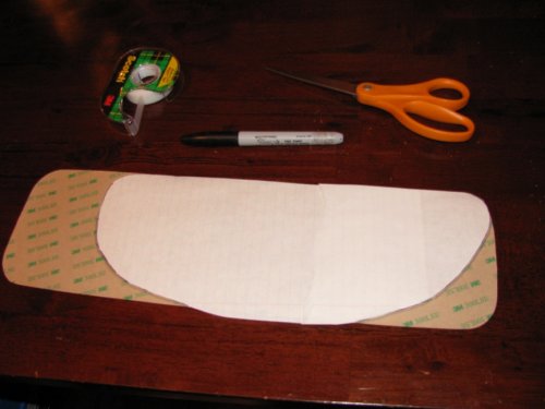 Put the pattern on the back side of the StompGrip and trace the outline with a permanent pen.  Then simply cut it with scissors.  Following the instructions that come with the kit, make sure you have round corners.
