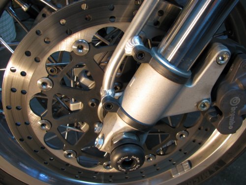 Remove the two bolts that hold the fender bracket, using a 4mm Allen wrench.
