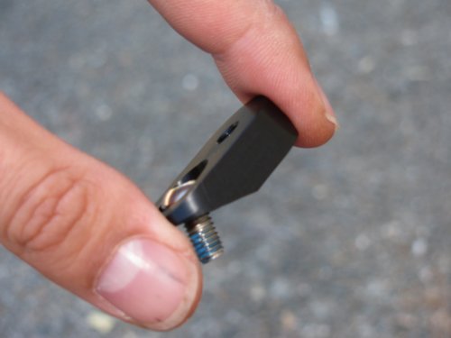The smaller screw in place and with thread locker applied.
