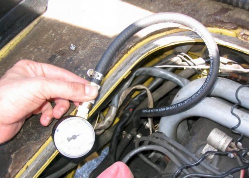 My complete, $14.00 fuel pressure gauge hooked up.  Use 8mm (5/16") fuel pressure hose and a 0-60psi gauge (this way the center reading will be most accurate).
