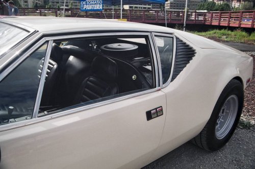 There is glass between the cabin and engine compartment.  I've been told the engine noise isn't too bad...
