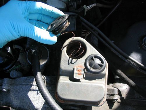 ...and finally place the spring and cap on the breather.
