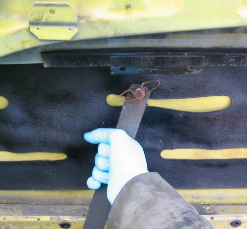 Either slide the arm out from the bracket or slightly pull down and towards you to release from lifter channel.
