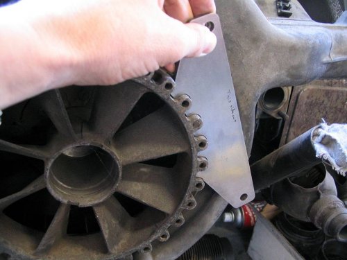 ...all the way until it stops.  Now the pulley lock mounting bolts can be screwed into the fan housing retaining mounts.
