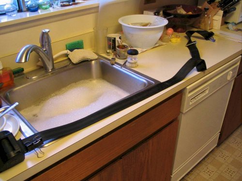 All stretched out and ready for a bath.  Scrub both sides gently in hot, soapy water.  Rinse both sides in fresh, hot water.
