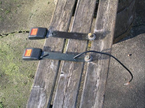 These are the belt latches.  I cut the seat belt warning wire from the latch after the photo was taken.
