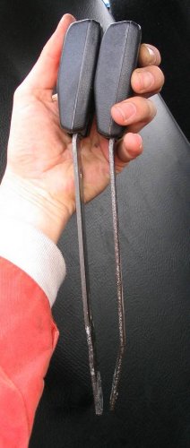 You'll need to straighten the latches.  Here I've straightened the left (driver side) latch.  The right one is the unstraightened passenger latch.
