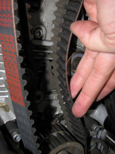 Because the teeth line up on the center pulley you can place the replacement belt right next to the old belt, lining up the belts tooth to tooth.  No need for counting!
