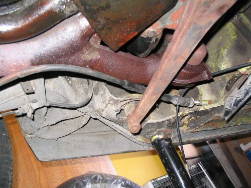 Notice e-brake cable is above engine bar.  Remember this when installing engine.
