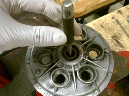 Use a drift to tap out the push rod.
