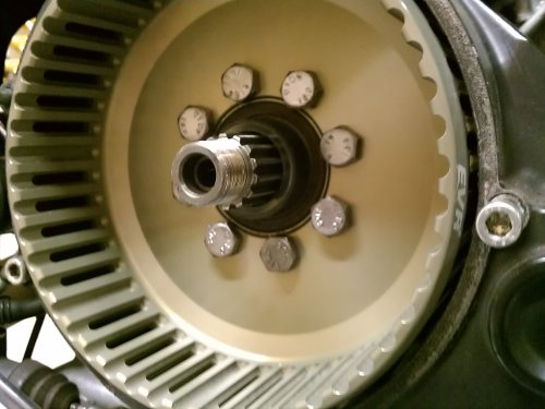 Now remove the 4 bolts, apply thread locker, and install the 8 bolts according to the workshop manual.  The local Ducati dealership said it would be perfectly fine to reuse the bolts.  I had to hold the clutch basket and torque down the bolts...it was NOT easy!  I had no tool to hold it.  Next time I'll get a tool or hold the basket and have someone else torque the bolts.  I originally removed the bolts with my air gun so there was no need to hold the OEM basket.
