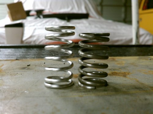 Height difference between the new stainless steel spring on the left and the tired steel OEM spring on the right.
