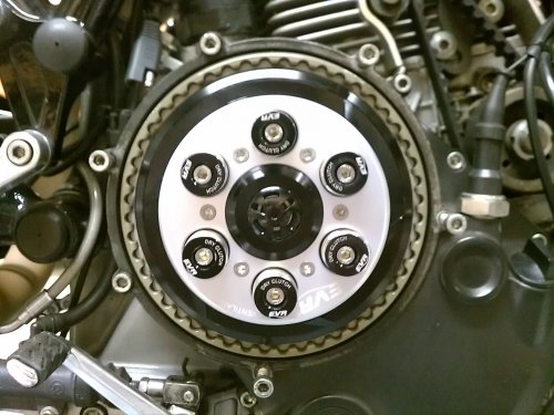 Vented EVR pressure plate mounted and springs/spring caps installed.  In a star pattern, screw the bolts all the way down until they stop, THEN you continue the star pattern to torque them down.  I placed the EVR logo at about the 4 o'clock position and then torqued the bolts, allowing the cap to rotate and thus line up neatly.  It did take several tries.
