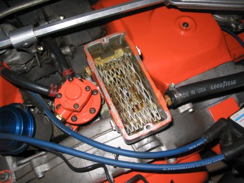 With the foam removed you can see the expanded metal mesh it rests on.  The forward holes are above the mesh while the rear holes are below it.
