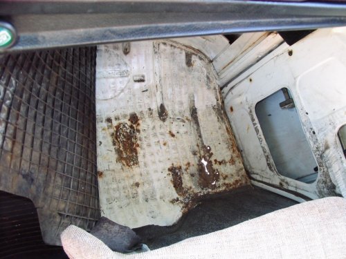 Right side footwell has some rust-through.
