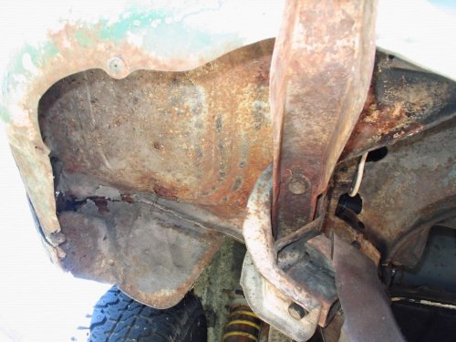 Looking at the left side, underside, aux. battery area.
