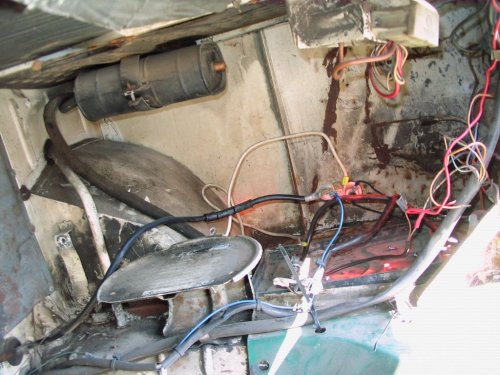 Inside the engine compartment looking at the right side battery area.
